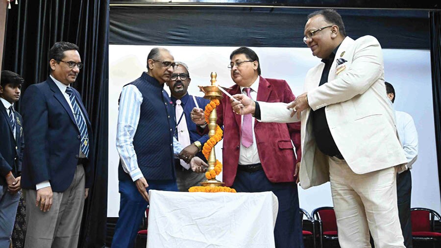 The ceremonial lamp being lit by T.H. Ireland, principal of St James School, Neville Holt, vice-principal and the chief guest, Pawan Kumar Patodia