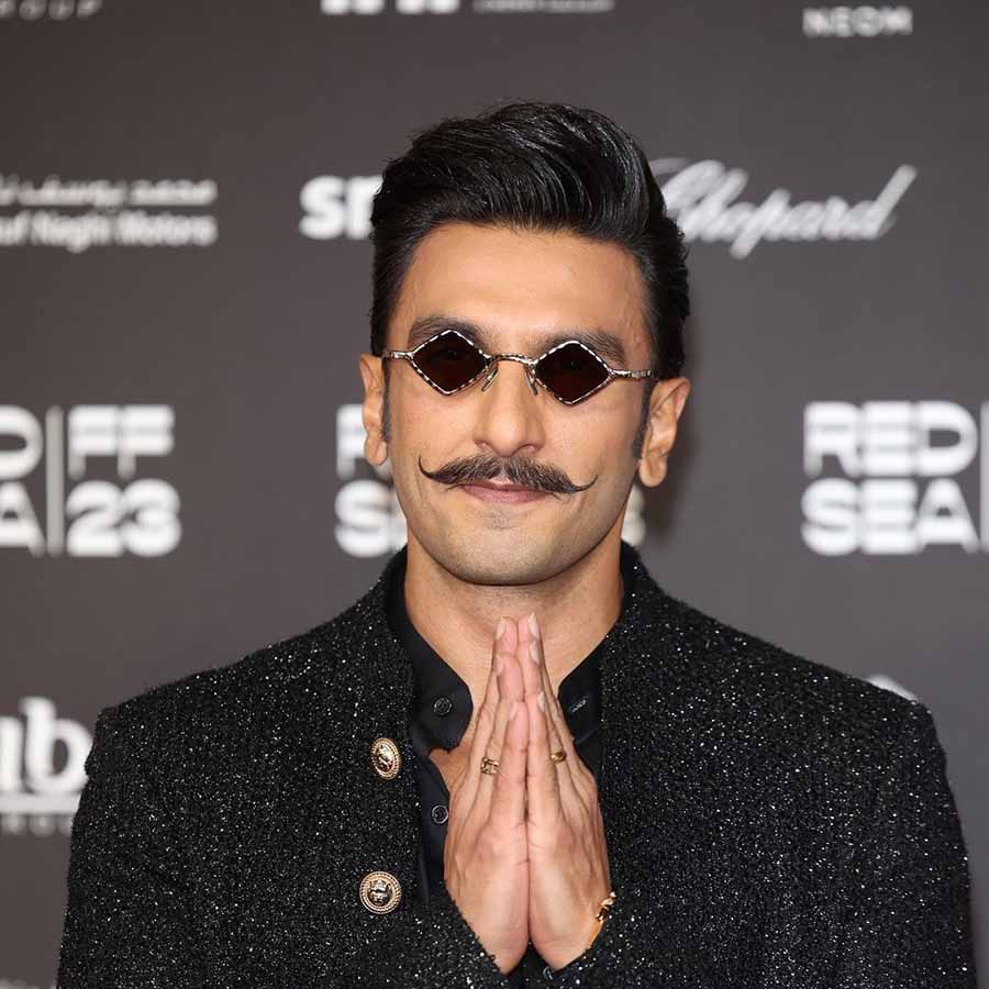 A moustache-sporting Ranveer Singh wore retro glasses and a shimmering black blazer. He greeted the crowd with ‘namaste’.