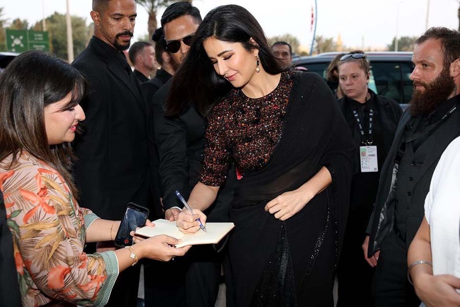 Katrina Kaif, looking ethereal in a sequined black saree, was spotted signing an autograph for a fan.