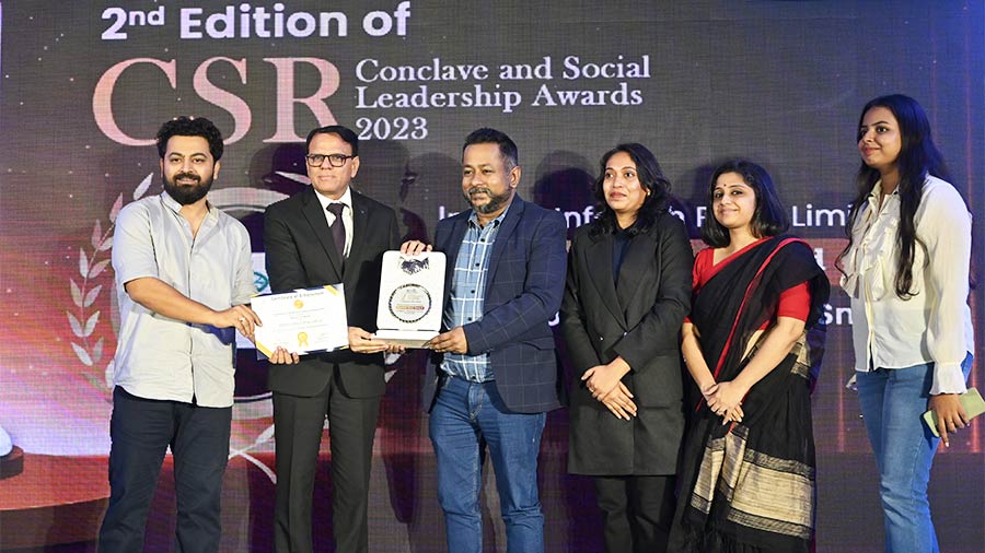 Representatives of Infinity Infotech Parks Limited collect their award at the 2nd CSR Conclave and Social Leadership Awards organised by BCC&I