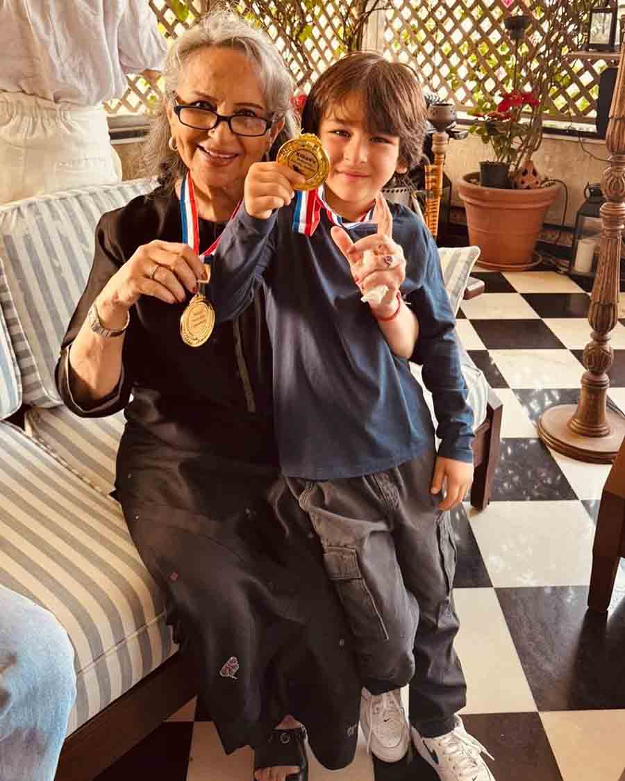 Sharmila and grandson Taimur pose with gold medals for a photo