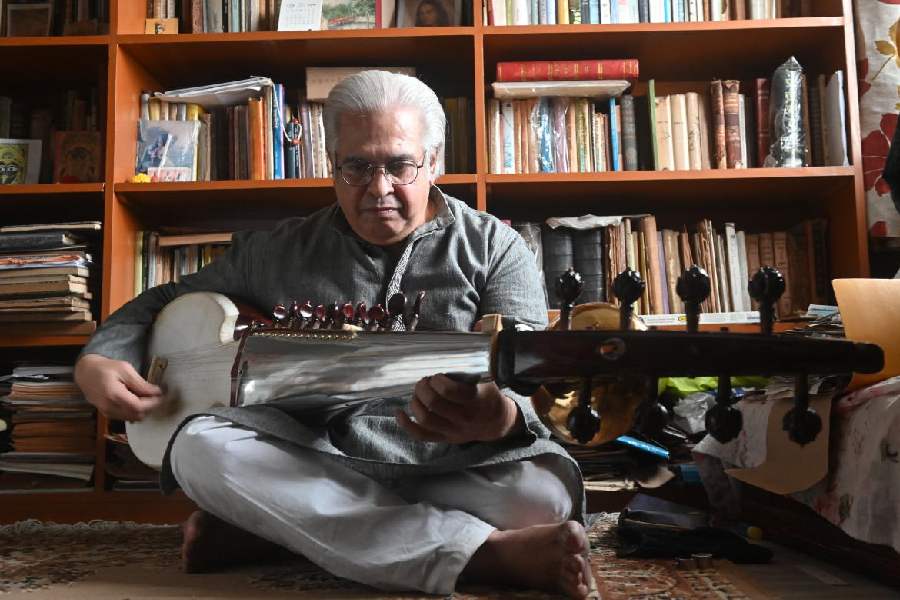 Anindya Banerjee plays the sarod in his south Calcutta home.