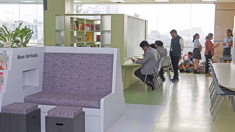 Students immersed in books at the state-of-the-art library