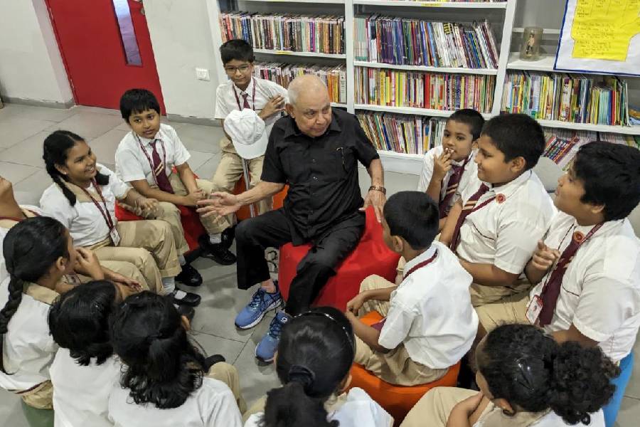Amiya Bhattacharya, 83, takes part in a storytelling session at Swarnim International School’s library