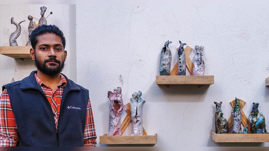 Pradhi Ranjan Sengupta with his exhibited ceramic sculptures at Studio Calyx