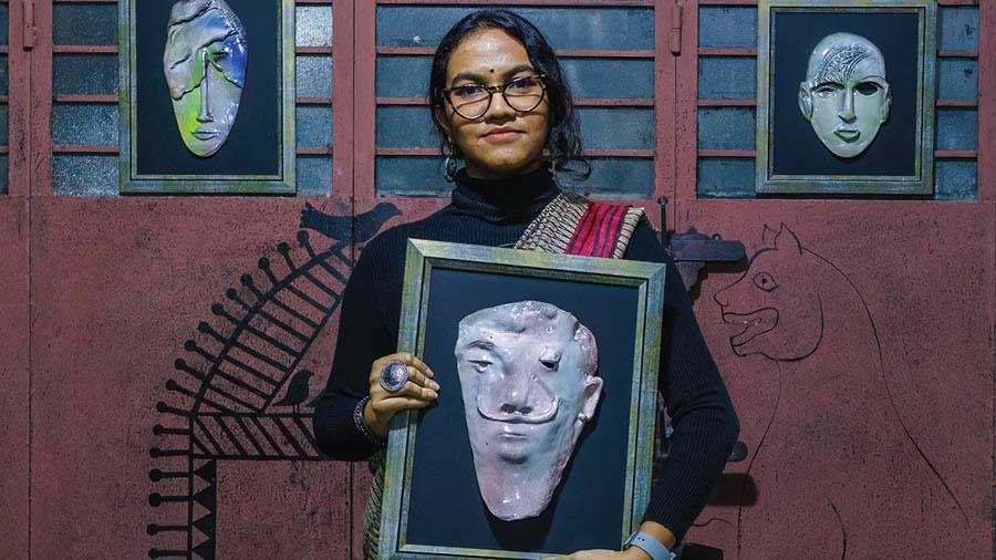 Saanjiti Dey with her ceramic mask work