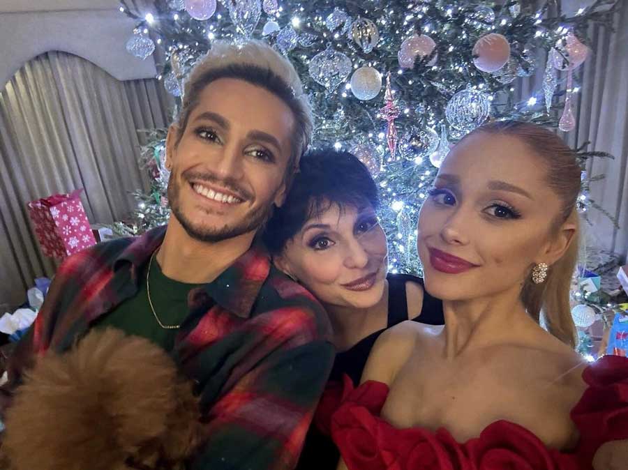 Clad in an off-shoulder floral red dress, Ariana Grande shared a selfie with mother Joan Grande and brother Frankie James Grande. The trio was dressed in shades of red and black. 