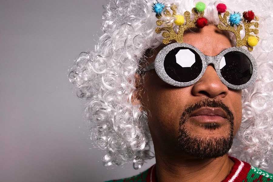 Will Smith rocked a funky look as he matched a white wig with sparkling sunglasses and colourful reindeer horns.  