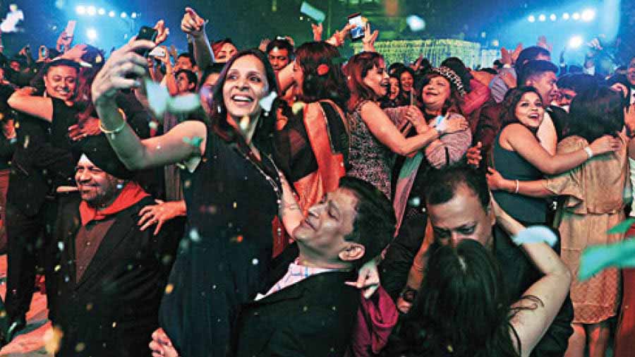 That total moment of exuberance or the ‘madness at midnight’ — a defining characteristic of New Year’s Eve gatherings — at a party at CCFC in Kolkata