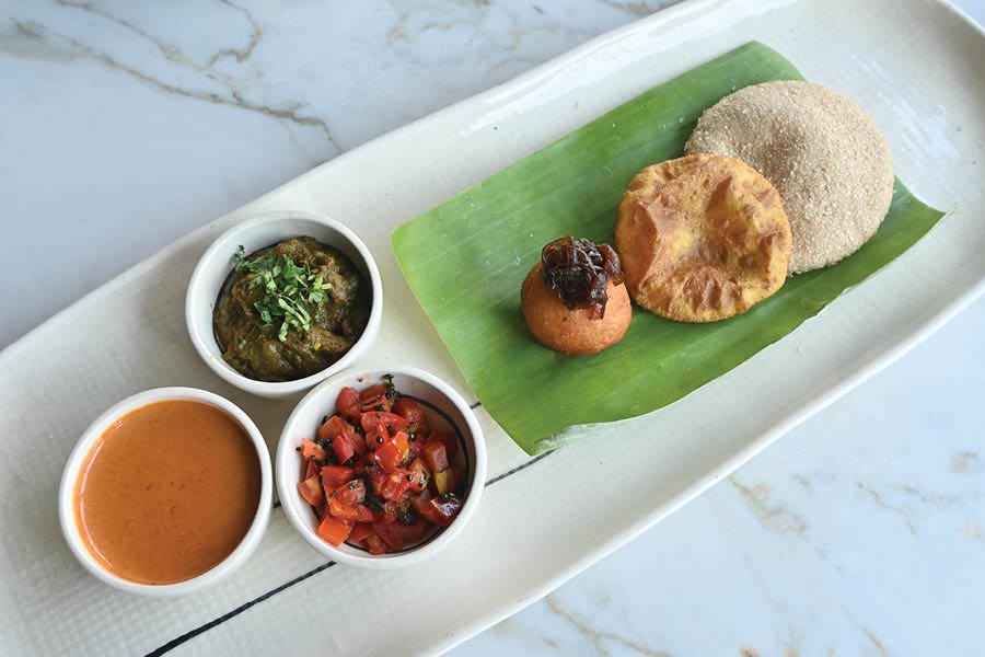 Poie served with kalchi kodi — a breakfast staple in Goan households 