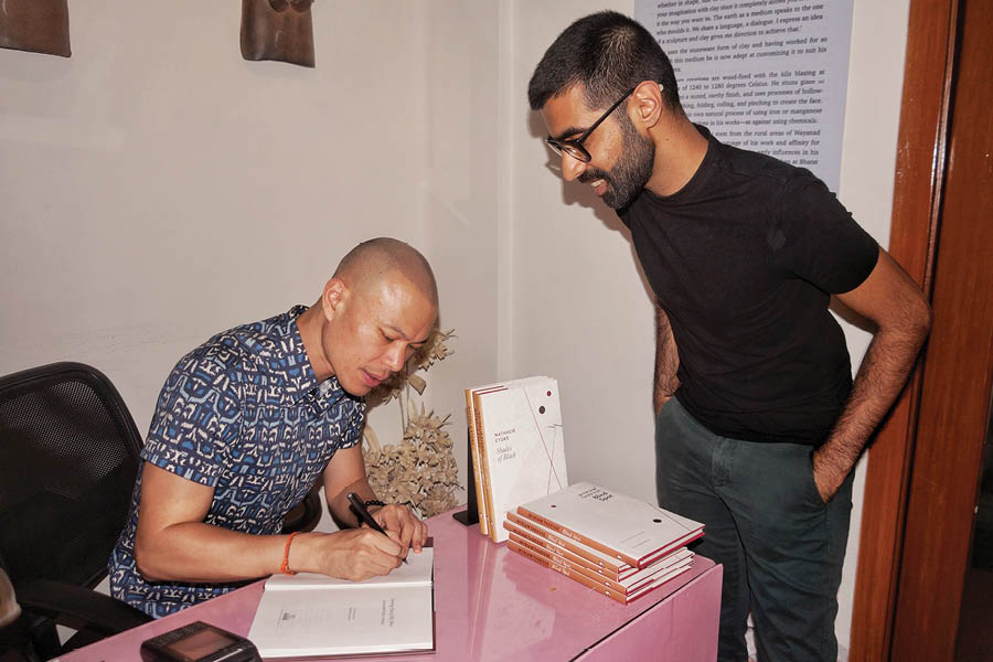 Phou signing his book at Seagull Books, Kolkata