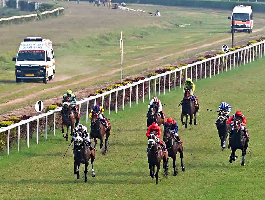 Horses and jockeys vie for position