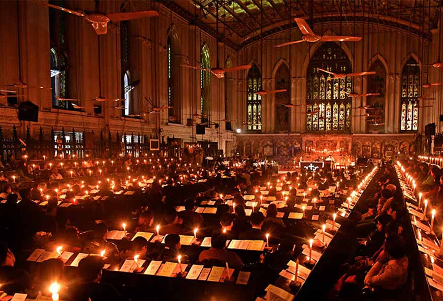 Candles aglow as people gathered for Midnight Mass at St. Paul’s Cathedral  