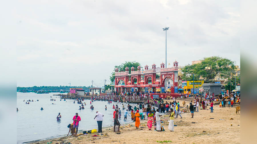 Rameswaram beach with devotees taking a ritual dip in the sea 