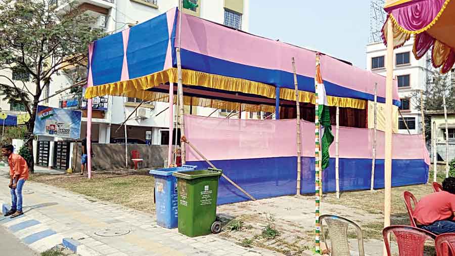 Cheek by jowl: The Saraswati puja pandal of Newtown CC Block Puja Samity next to the partly visible pandal of Newtown CC Block Residents’ Welfare Association