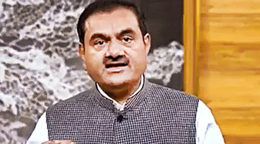 Gautam Adani addresses investors from an unknown location in this video.
