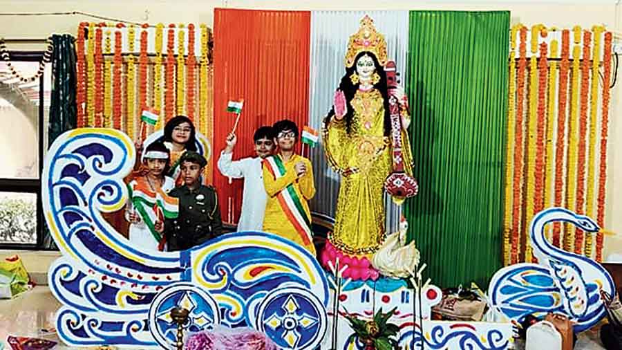 Children of Greenfield Heights in New Town pose behind a two-dimensional swan-drawn chariot of goddess Saraswati. “After two years of being trapped at home, we want to progress, hence the symbol of flight. Since it was also Republic Day, we planned the idol’s backdrop in the hues of the Tricolour,” said cultural committee member Urmimala Dasgupta. Neighbour Debashis Bhattacharya, an engineer, had lent a helping hand in the decoration, she added.