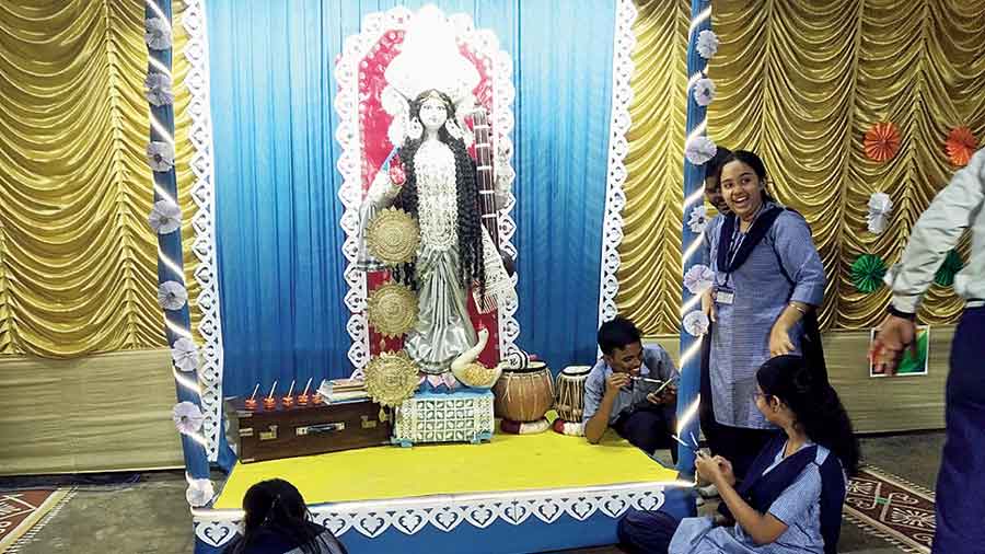 Students of Bidhannagar Government High School busy with puja preparations