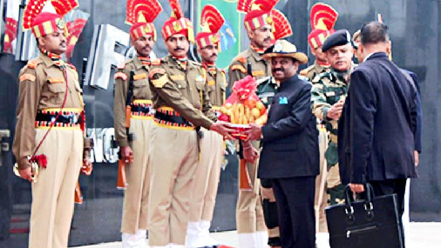 Governor CV Ananda Bose being welcomed by BSF officers in Fulbari on Thursday
