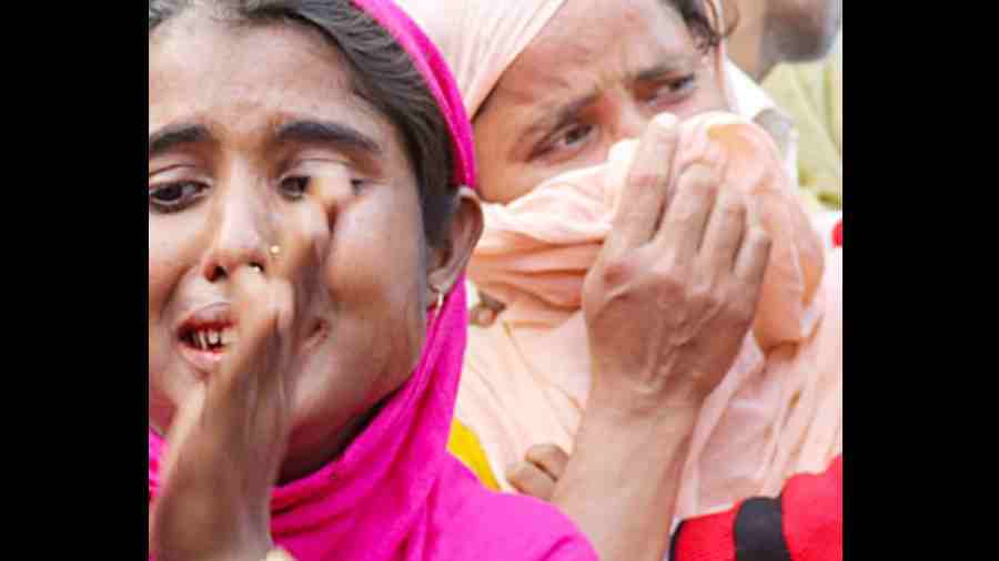 Relatives of some of those arrested on the charge of child marriage break down in Guwahati.