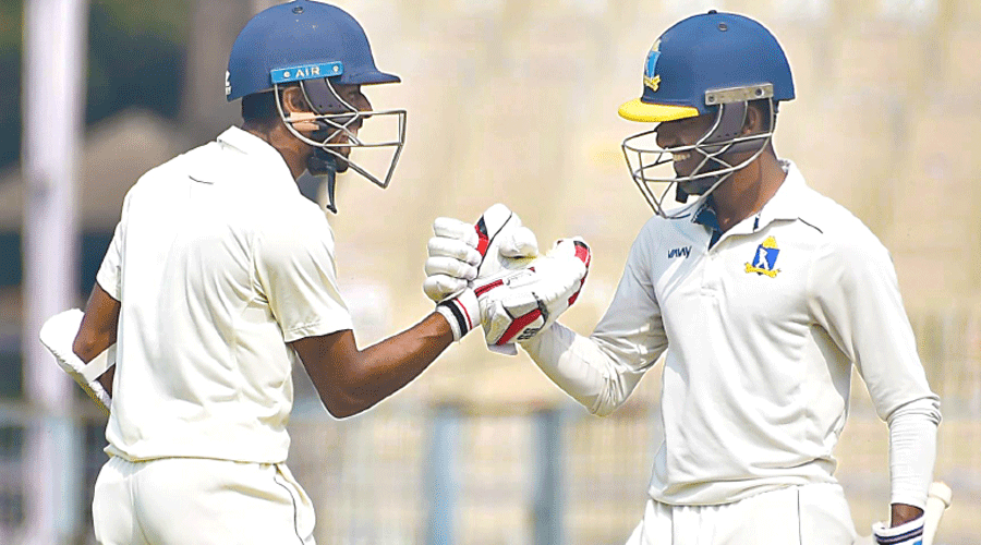 Abhimanyu Easwaran and (right) Sudip Gharami after Bengal’s quarter-final victory over Jharkhand on Friday.