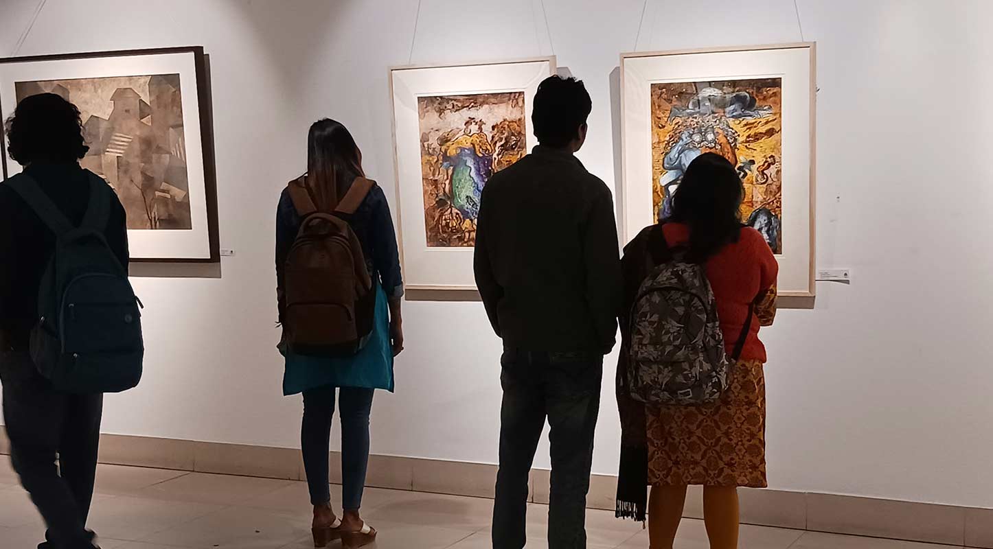 Visitors view the artworks