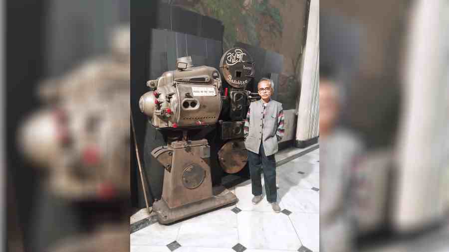 Debjiban Basu beside the 1947 projector that was in use at Basusree till recently.