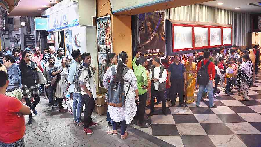 Movie-goers queue up for a show of Pathaan at Basusree Cinema on Saturday. 