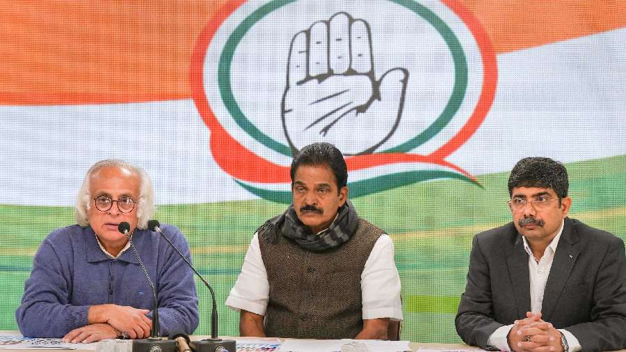 Congress leaders Jairam Ramesh, K.C. Venugopal and Vineet Punia during a press conference at party headquarters in New Delhi