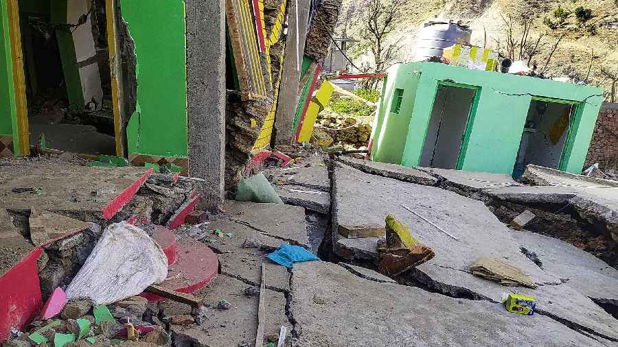 Wide cracks at a building in the land subsidence affected Nai Basti area, in Doda district, Jammu & Kashmir