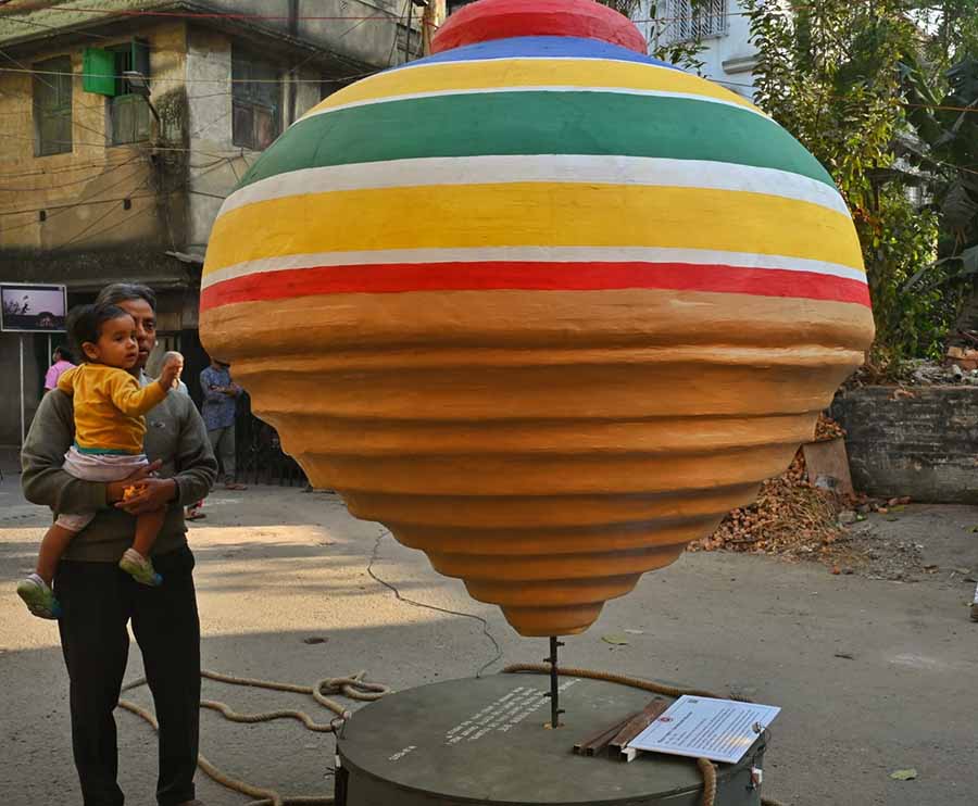 Artist Samindra Nath Majumdar has created this giant spinning top to show that one needs to be bound first to be unbound