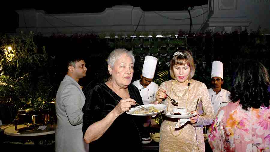 Guests enjoyed piping hot Khawsuey and the delicious spread by Roots. In picture, June Tomkyns and Priscilla Corner enjoying their dinner.