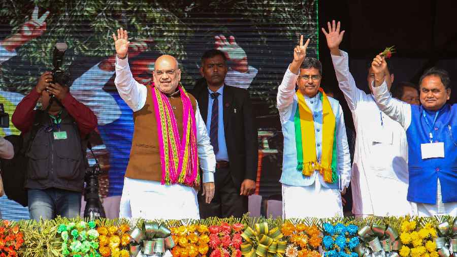 Union Home Minister Amit Shah with Tripura Chief Minister Manik Saha during a public meeting for the upcoming Tripura Assembly elections, at Santirbazar in South Tripura district