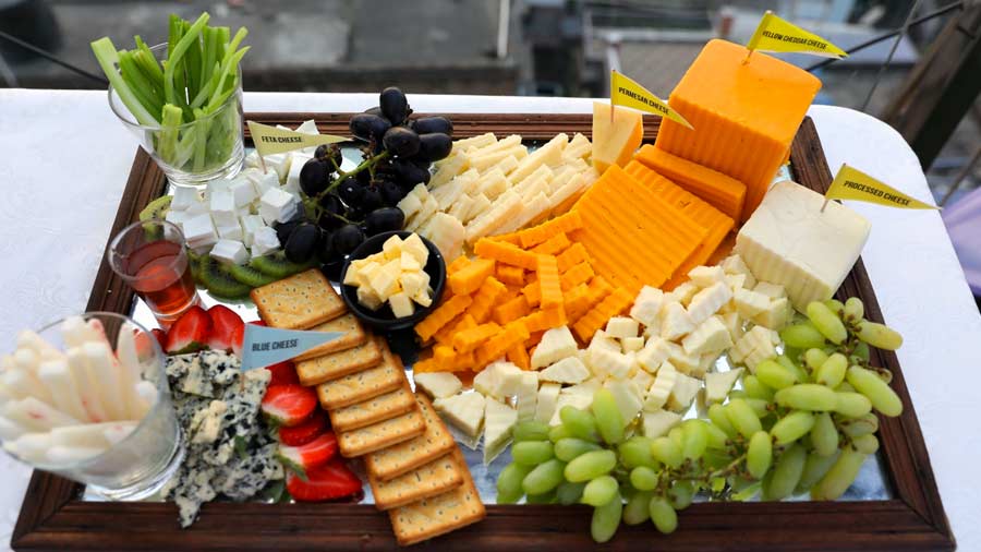 If there’s wine, can cheese be far behind? This gorgeous cheese platter was layered with feta, blue cheese, yellow cheddar, grapes and strawberries, along with bread and crackers. 