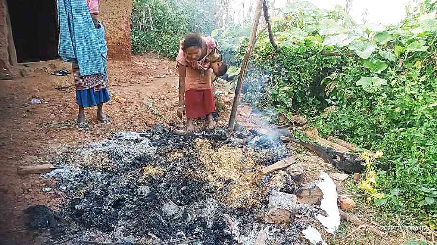 A villager in Tonto shows household items burnt by security forces during a search operation in West Singhbhum last December