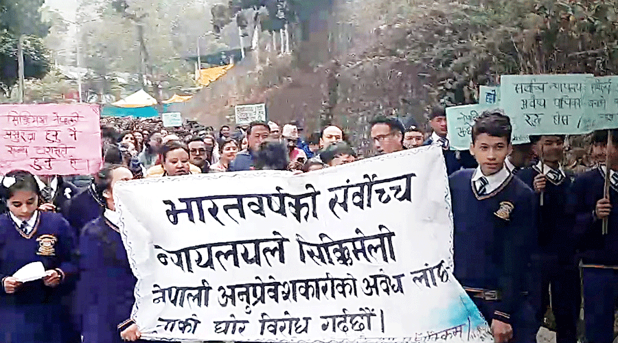 School students take out a march under the banner of JAC at Dentam Bazar  in west Sikkim on Tuesday.