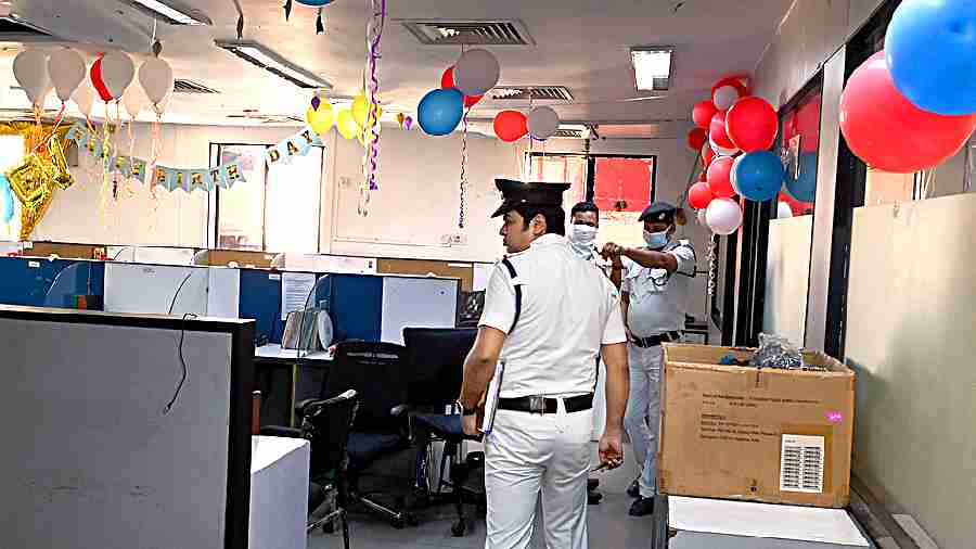 Policemen at the insurance company’s office in central Kolkata where 14 employees complained of breathing problem and had to be taken to hospital on Tuesday morning. 