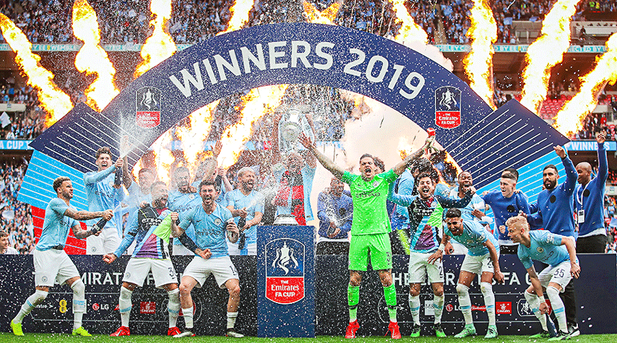 Manchester City players celebrate on winning the FA Cup, against Watford at the Wembley on May 18, 2019.