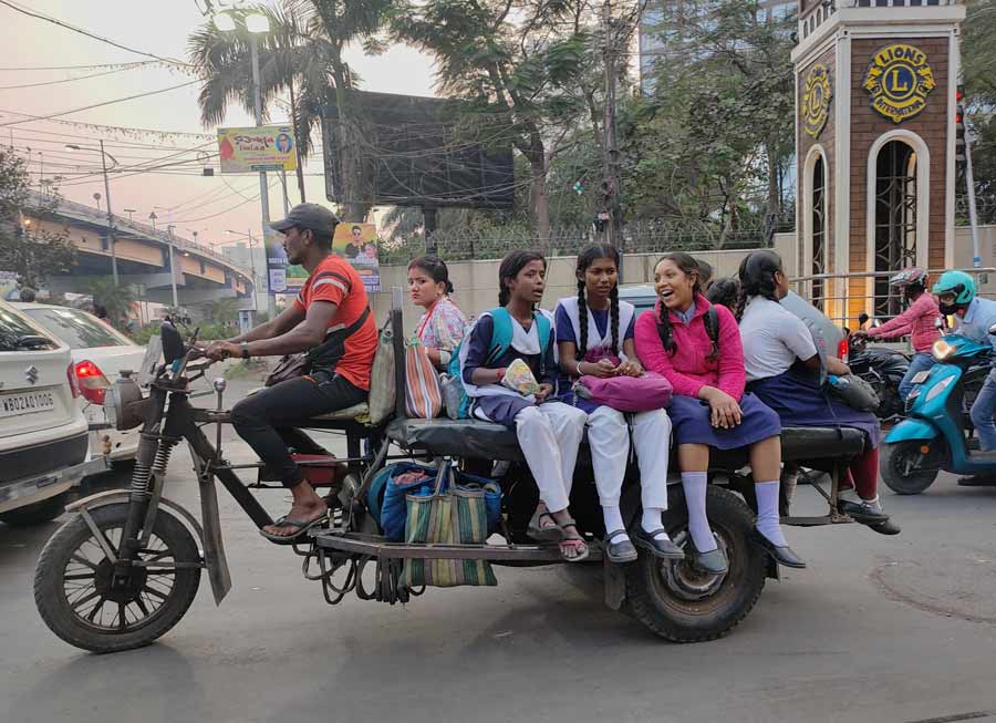 School students ride a diesel-powered open ‘jugaad’ van near Dhapa area, as they return home from school. The city has been experiencing poor air quality for quite some time and the use of uncertified fuel-based vehicles only adds to a declining AQI