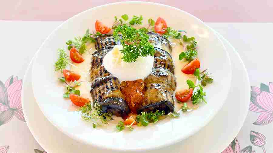 Eggplant Roulade has grilled eggplant stuffed with black lentil ragout and accompanied by-truffle flavoured poached egg.
