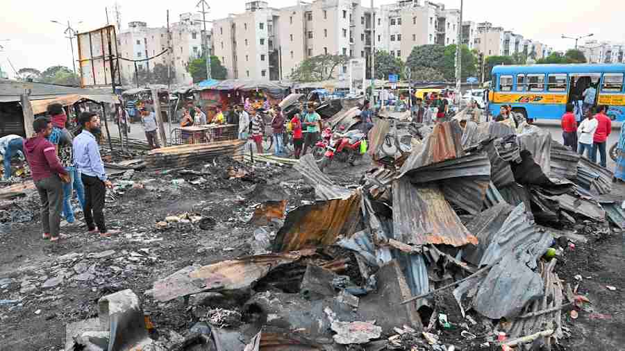 Stalls opposite Sukhobrishti Housing Complex in New Town destroyed in the fire early on Saturday. 