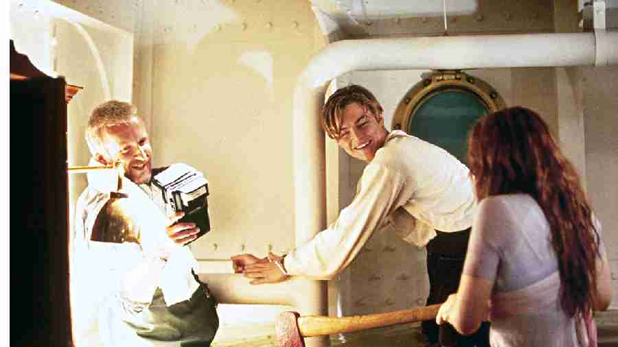 James Cameron (left) with Leonardo DiCaprio and Kate Winslet on the sets of Titanic