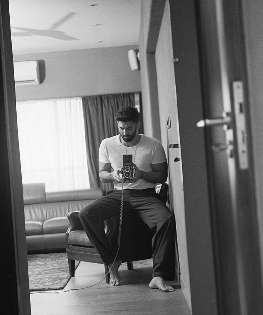 Aditya’s mirror selfies are quite a hit with his fans. He wears a white t-shirt and black pyjamas, accessorising his look with a chain in this one.