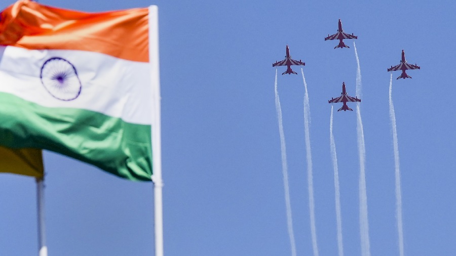 Suryakiran aerobatics team of the Indian Air Force (IAF) performs during the inauguration of Aero India. 