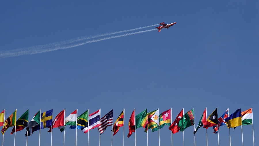 Suryakiran aerobatics team of the Indian Air Force (IAF) performs during the inauguration event. 