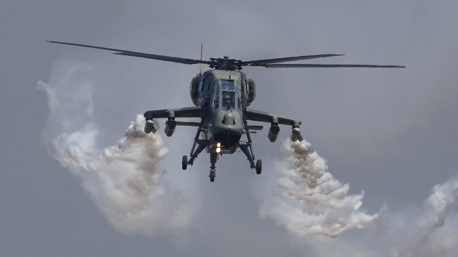 Indian Air Force's (IAF) Light Combat Helicopter (LCH) performs during the inauguration of Aero India 2023, at Yelahanka air base in Bangalore. 
