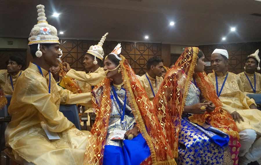 Soon-to-be-wed couples at a mass wedding ceremony organised by NGO ‘Aloy Fera’ in Paikpara on Tuesday