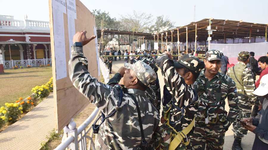 Security personnel search a list for their elections duty at a distribution centre. Old rivals, the Left and the Congress, have joined hands to take on the BJP, with leaders, including CPI(M)'s Sitaram Yechury, Prakash Karat and Mohammad Salim and the grand old party's Adhir Chowdhury and Dipa Dasmunshi, travelling across the length and the breadth of the tiny state, highlighting the 'failed promises of the BJP and instances of misgovernance'.