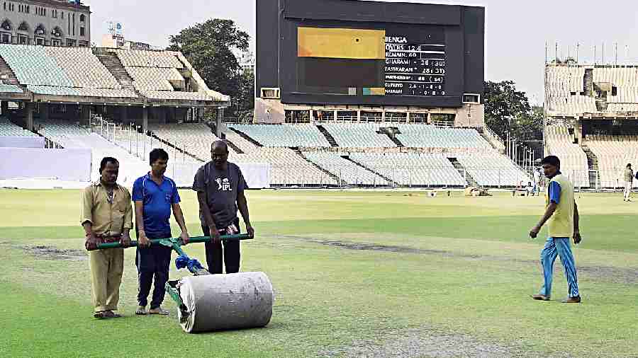 Groundsmen prepare the pitch