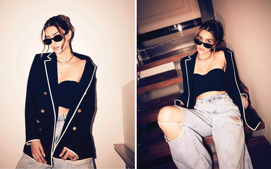 Her latest promotional look was a simple cropped bralette paired with a classic Maison Valentino blazer and ripped jeans. A pair of sunglasses and minimal jewellery completed the look. 